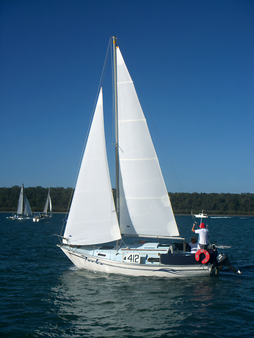 Classic cruising sailboat on blue water